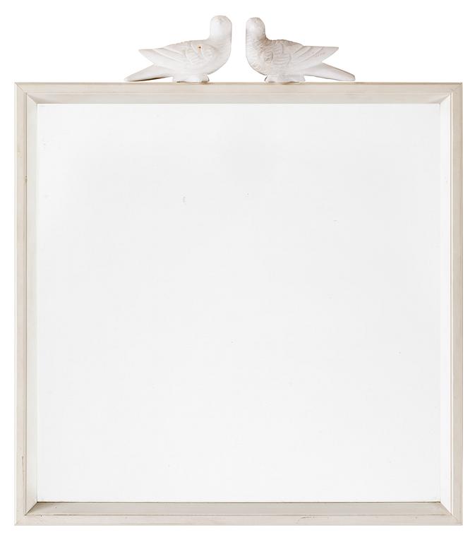 An Estrid Ericson wooden framed mirror with a pair of alabaster pigeons by Svenskt Tenn.