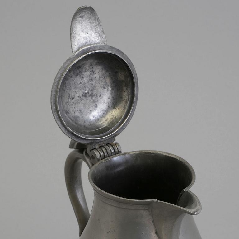 A 18th century tin pot.