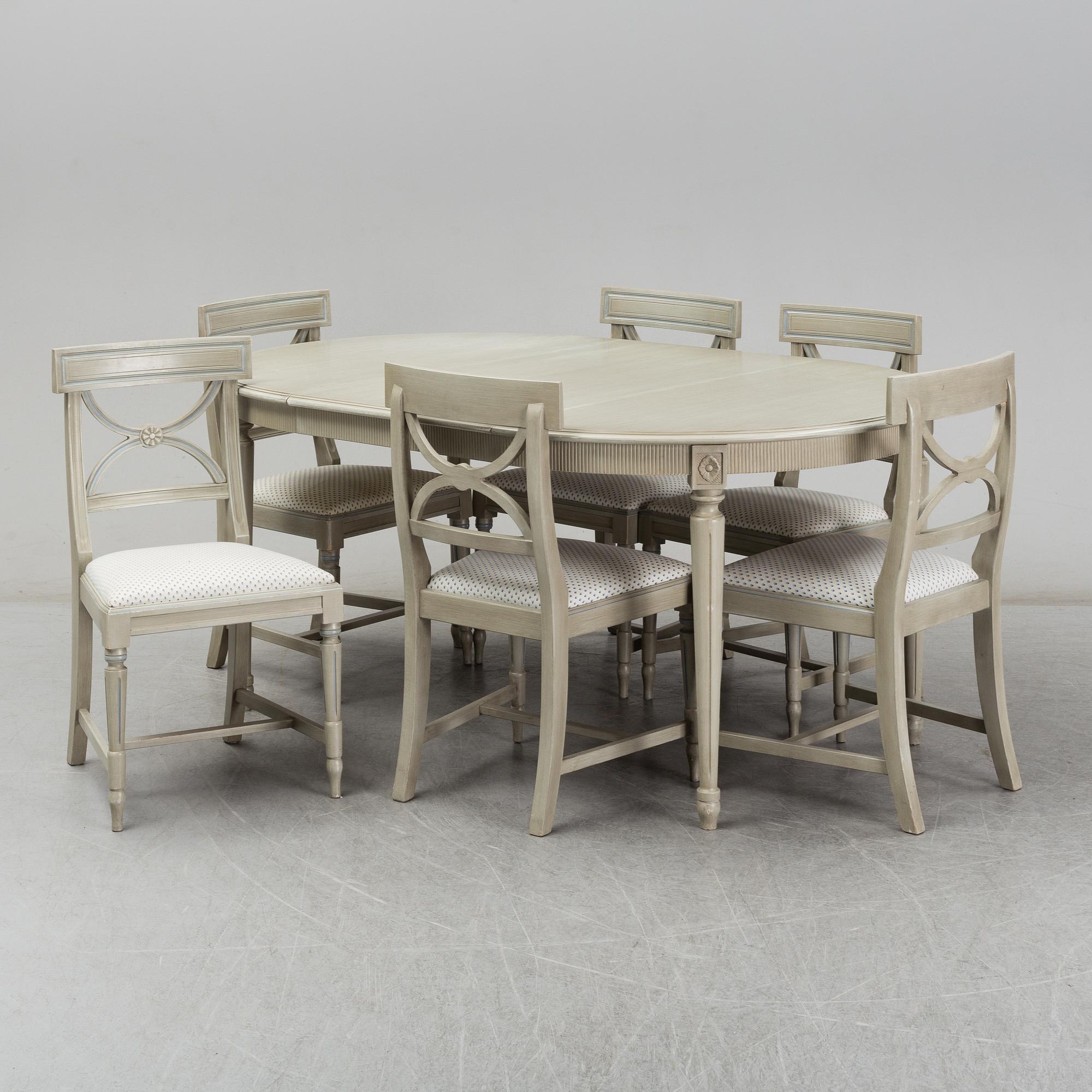 A dining table and six chairs, Gustavian style, second half of the 20th century. One leaf included.