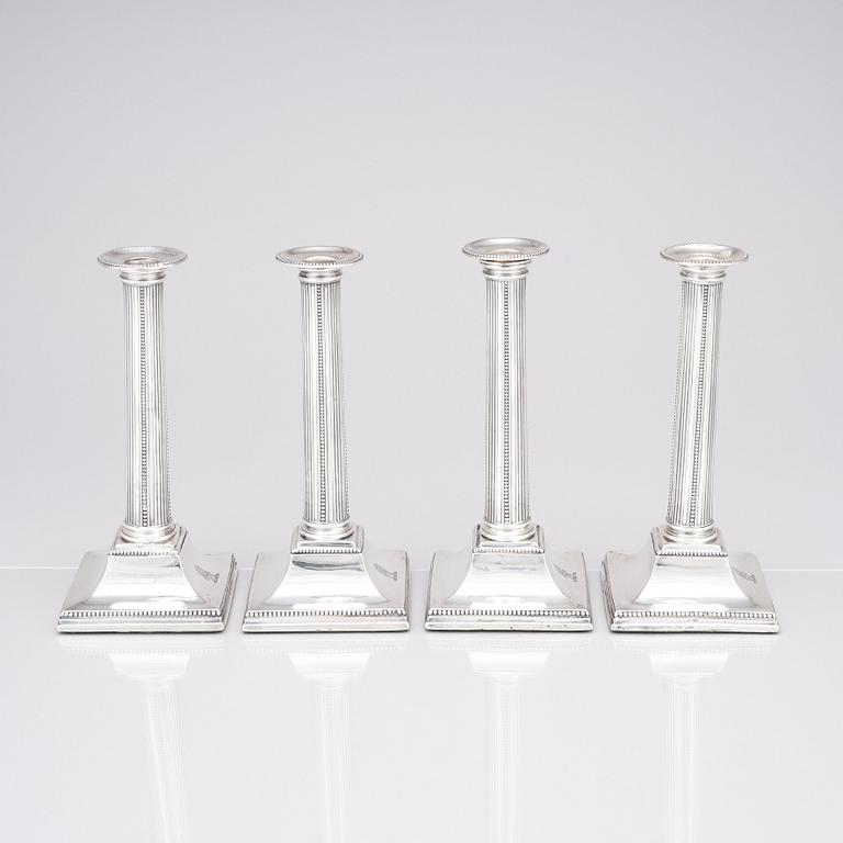 Four English 18th century silver candlesticks, mark of Young, Greaves & Hoyland, Sheffield 1780.