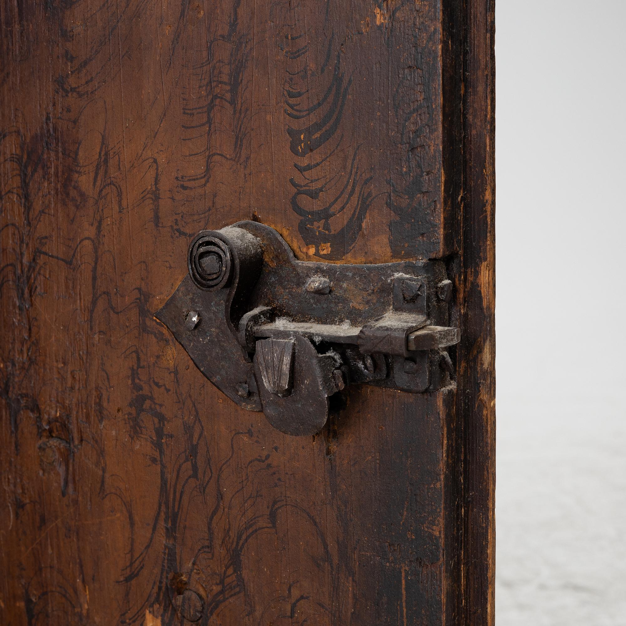 A corner cabinet, 18th Century.