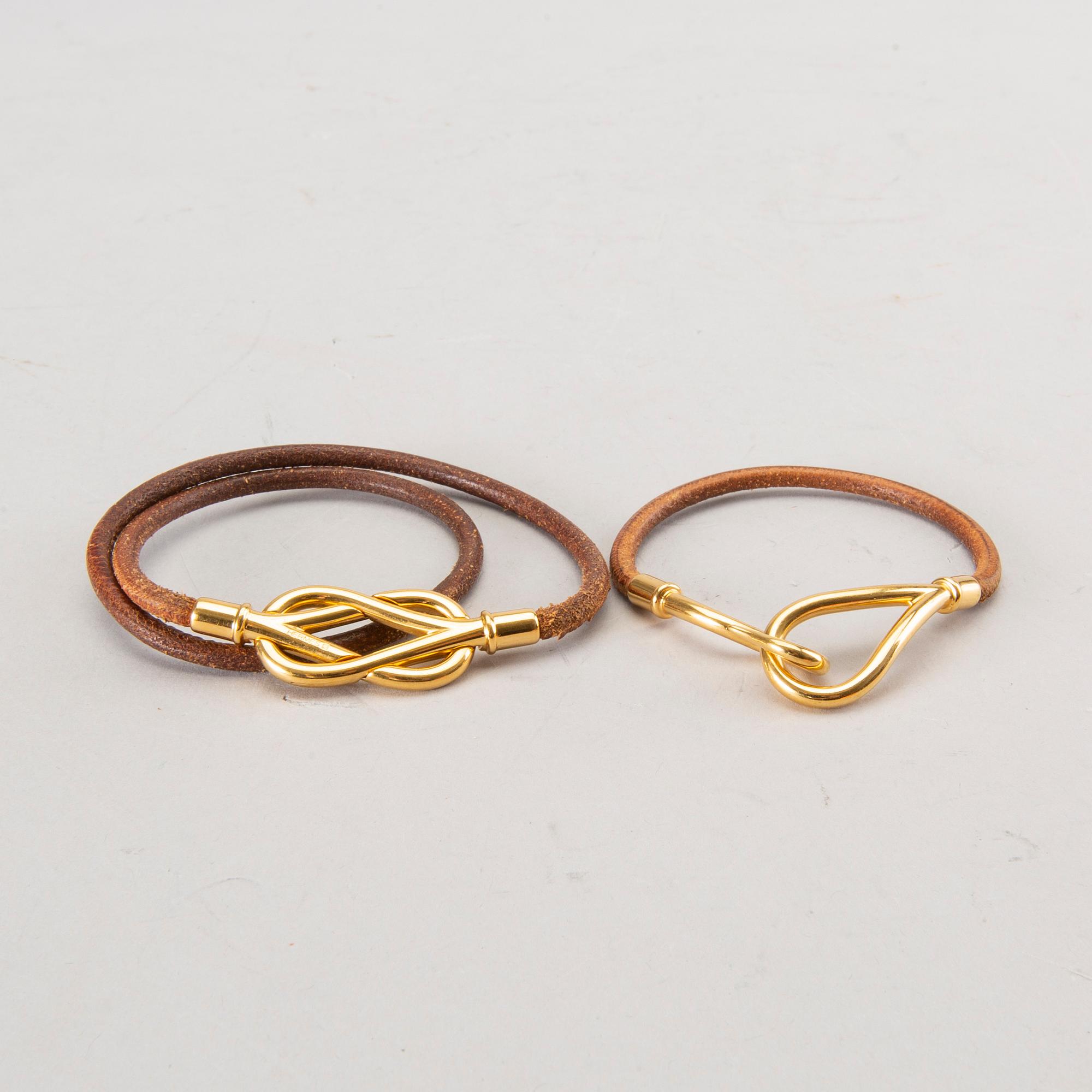 Two Hermès braclets.
