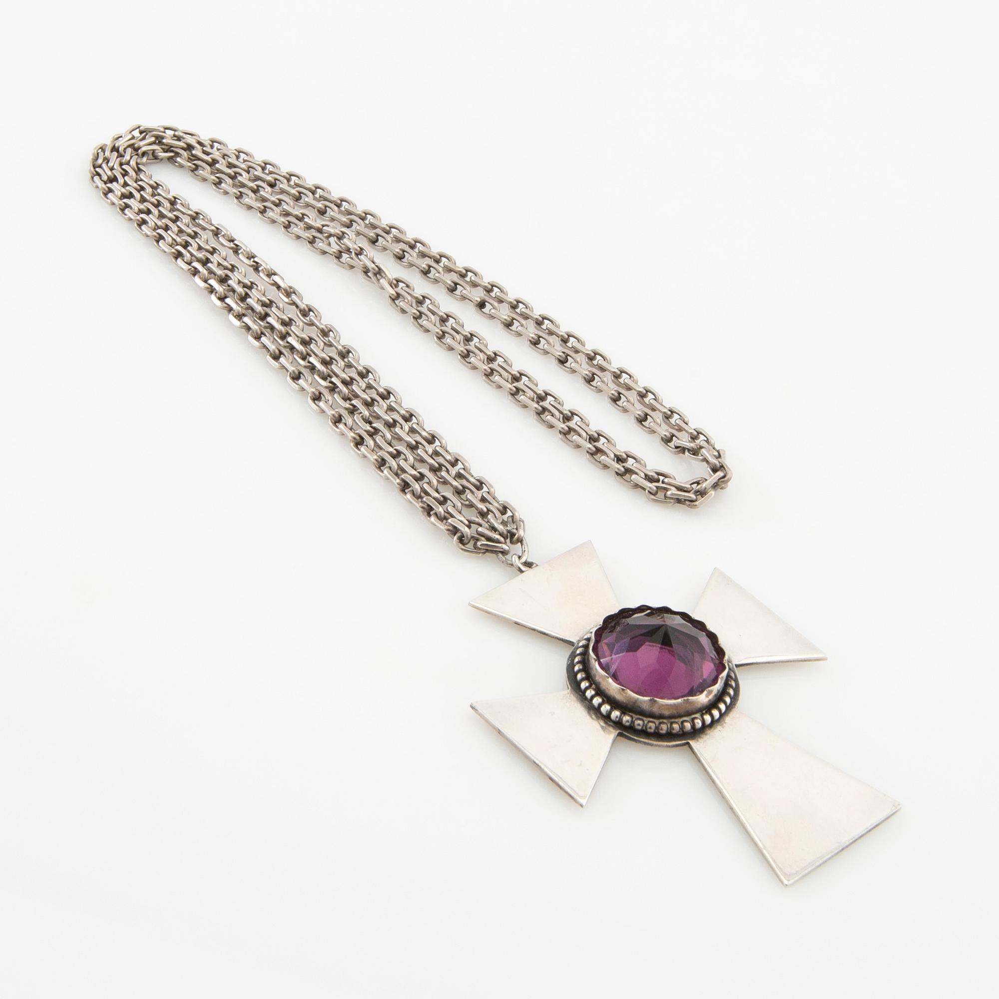 Necklace of silver in the form of a cross with faceted glass.