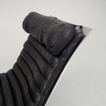 A black leather "Ari" easy chair with foot stool by Arne Norell for Norell möbler.