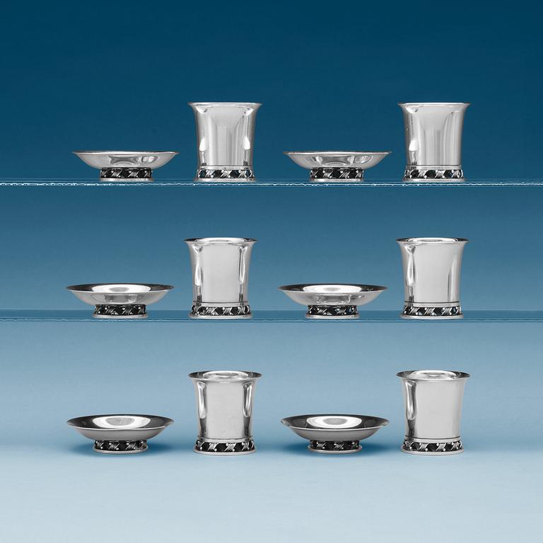A Harald Nielsen set of 12 sterling ashtrays and cigarette jars, Georg Jensen, Copenhagen 1933-44.