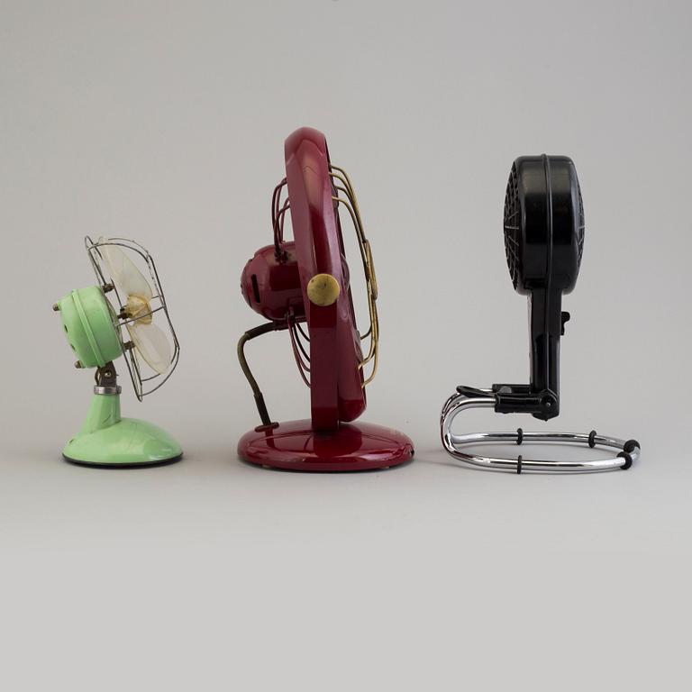 a set of three plastic and bakelite fans, mid 20th century.