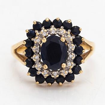 An 18K gold ring with sapphires and diamonds ca 0.14 ct in total. Unclear hallmarks.