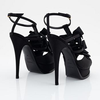 Yves Saint Laurent, a pair of black silk and bows platform sandals, size 37.
