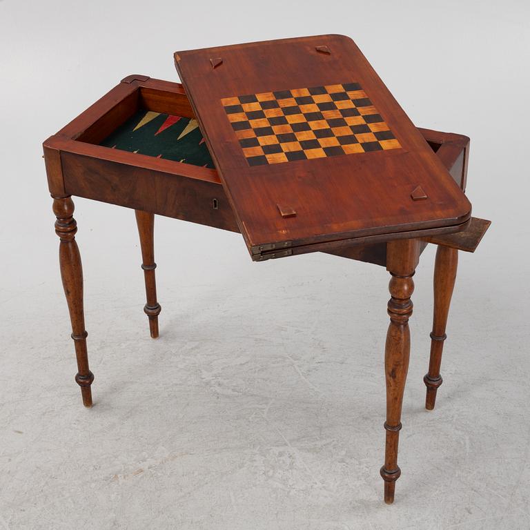 A mahogany games table, mid 19th Century.