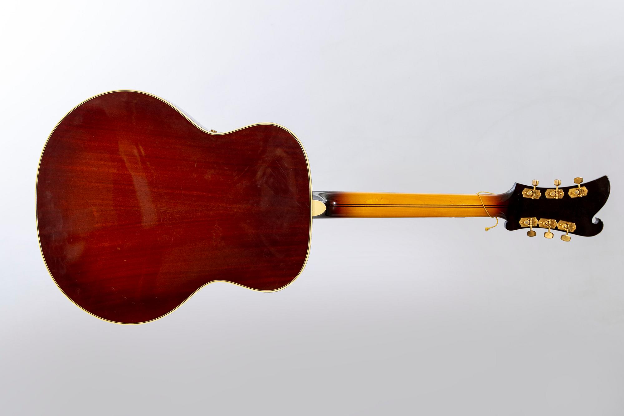 A Crafton Rex acoustic guitar.