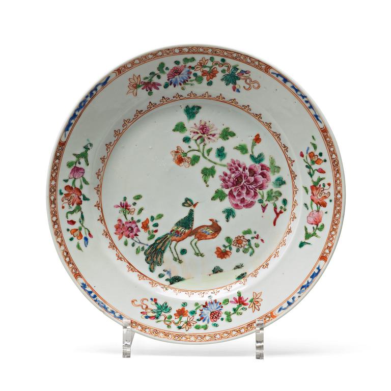 A set of 12 famille rose 'double peacock' dinner plates, Qing dynasty, Qianlong (1736-95).