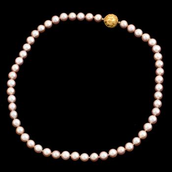 A pearl necklace with an 18K gold clasp by Gaudy according to information given.