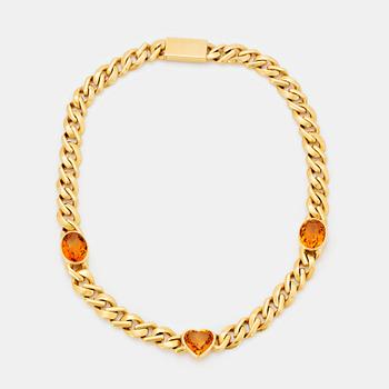 445. An 18K gold necklace set with faceted citrines.