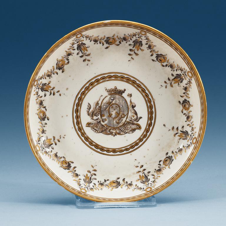 A Marieberg soft paste armorial saucer, dated 1781.