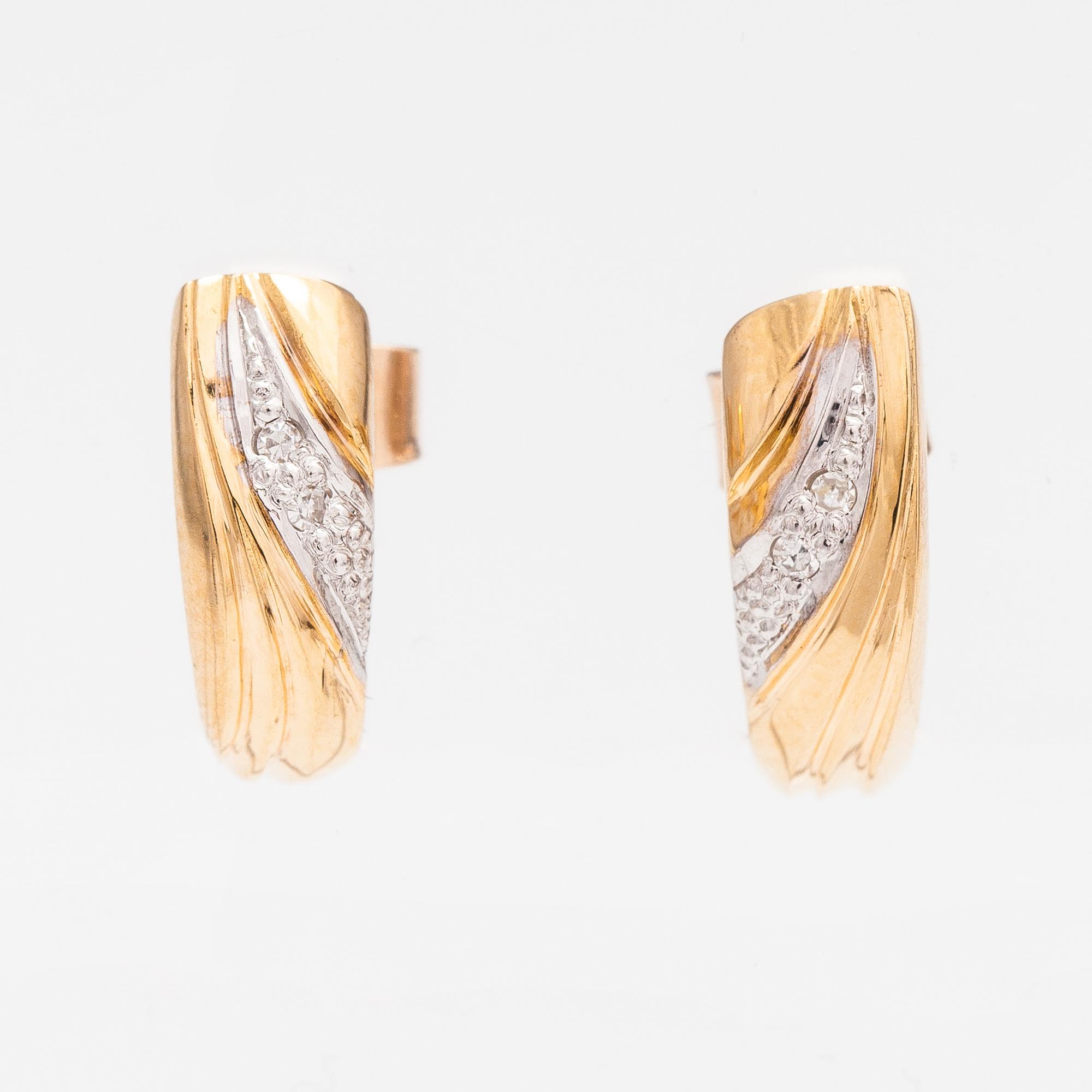 A pair of 14K ogld earrings with diaomnds ca. 0.036 ct in total. Finland 1992.