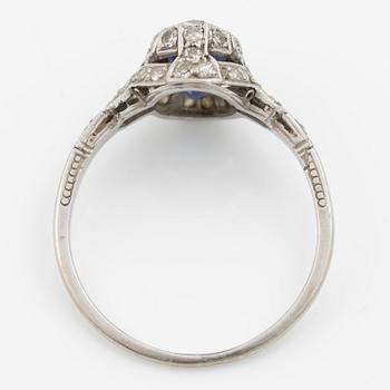 Ring 14K gold with a synthetic blue stone and small diamonds and white stones.
