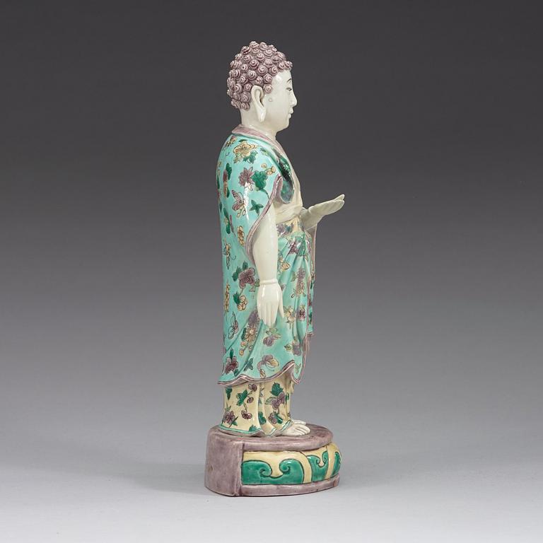 A famille verte figure of a standing Buddha, Qing dynasty, 19th Century.