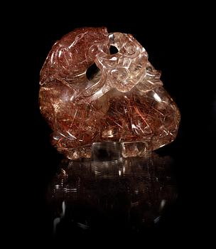 A carved quartz figure of a reclining deer with a dog and som fungus, China, early 20th Century.