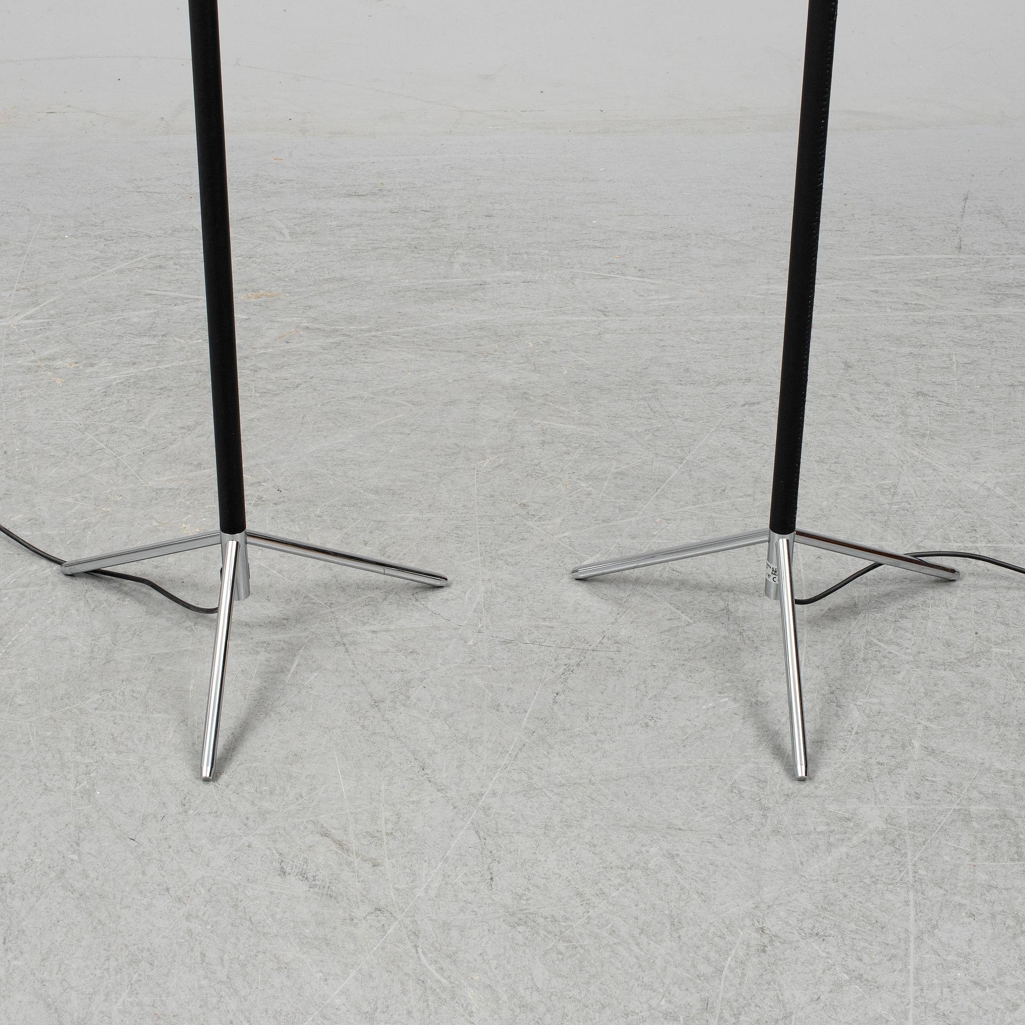 Three contemporary floorlamps by Santa & Cole.