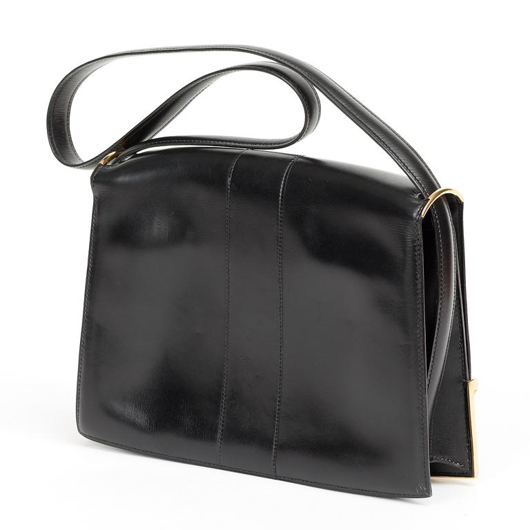 A 1970s black shoulder bag by Hermès.