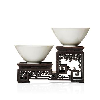 Two Chinese white glazed anhua decorated dragon bowls, Qing dynasty.