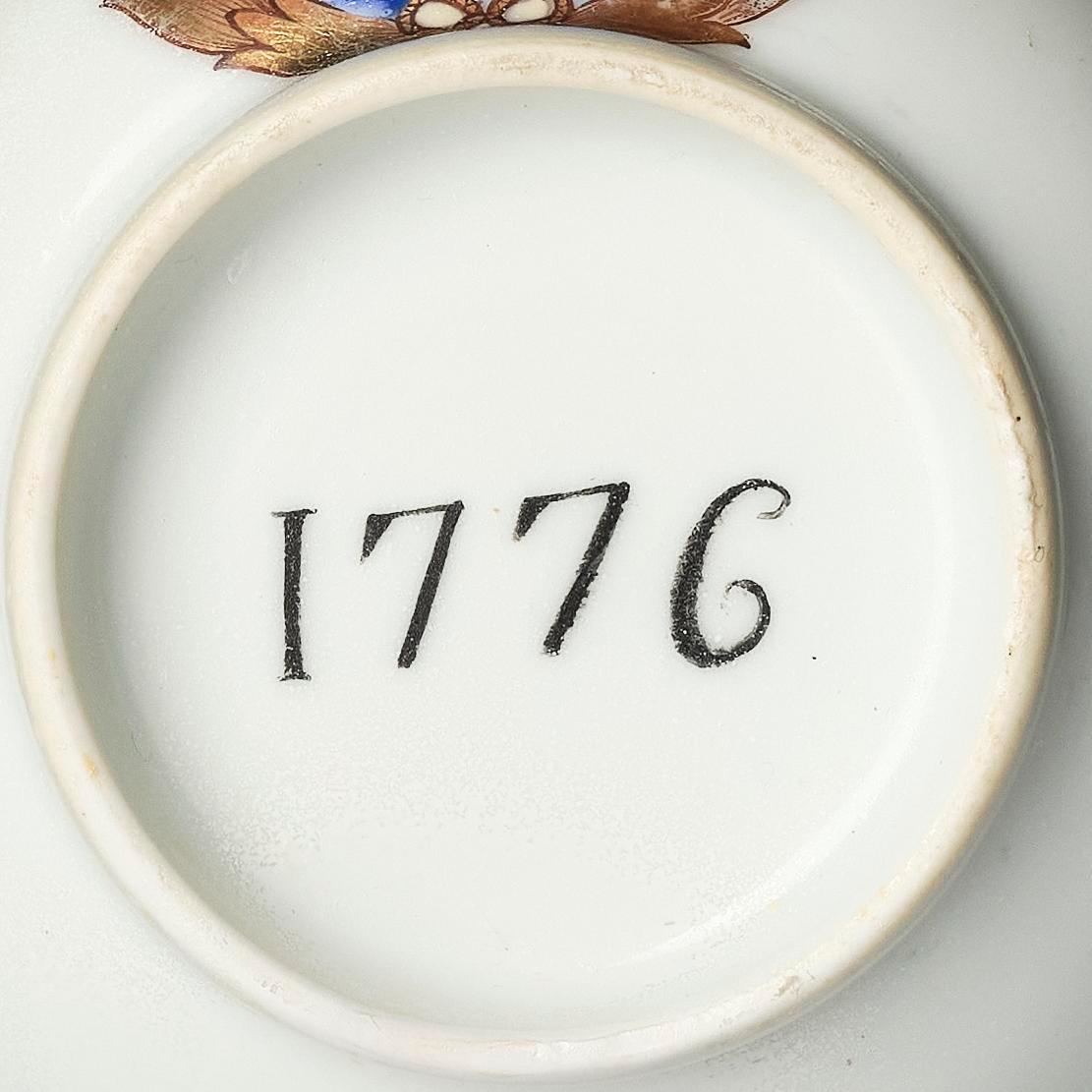 A famille rose armorial cup and stand with the monogram of the Swedish King Gustavus III, Qing dynasty, 18th century.