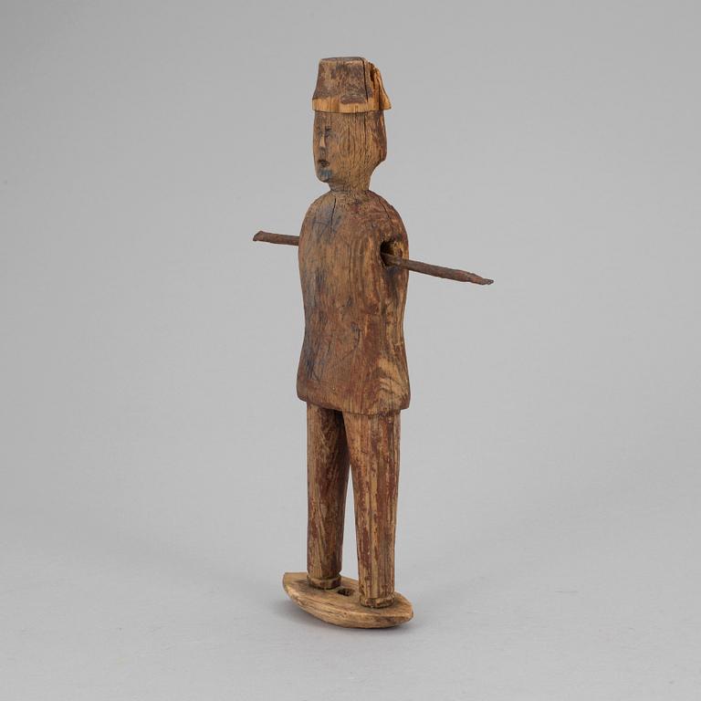 A wooden tool/sculpture, ca 1850.