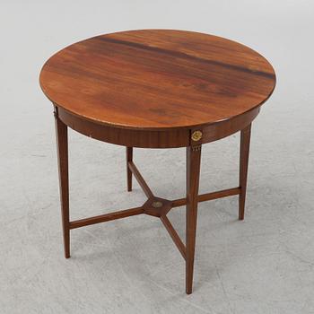 A mahogany veneered table, late 19th century.