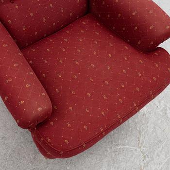 Carl Malmsten, a 'Häggbom' armchair with a 'Jättepaddan' ottoman, AB OH Sjögren, Tranås.