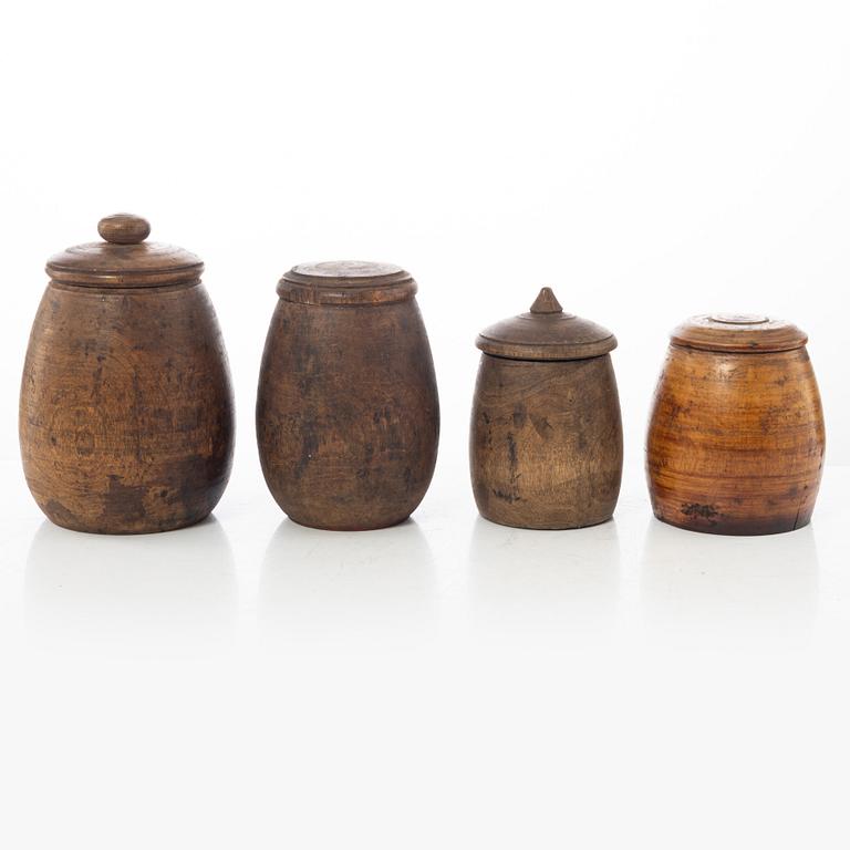 A set of four turned folk art jars, 19th century.