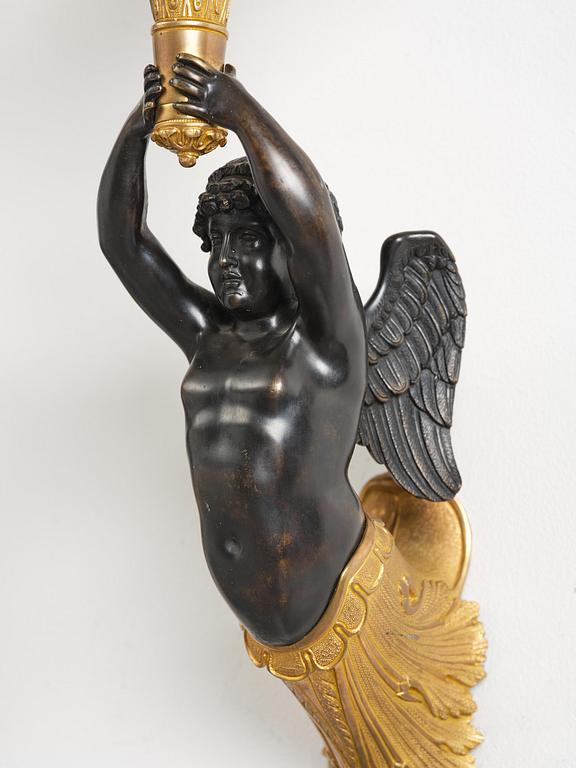 A pair of Napoleon III five-branch gilt and patinated bronze appliques.