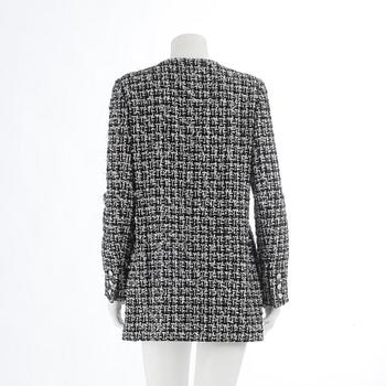 CHANEL, ablack and white bouclé jacket, spring 2009.Size 40.