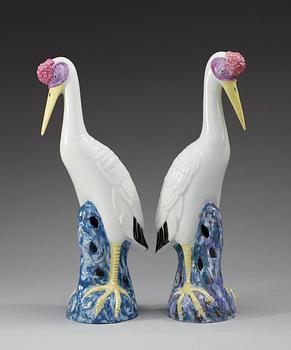 A set of two famille rose figures of cranes, Chinese presumably early 20th Century.