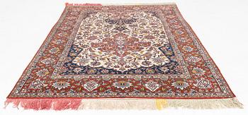 A part silk semi-antique Esfahan carpet, ca 226 x 144 cm.