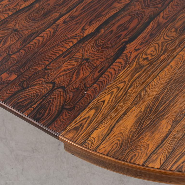 A 1960's/70's rosewood veneered dining group.