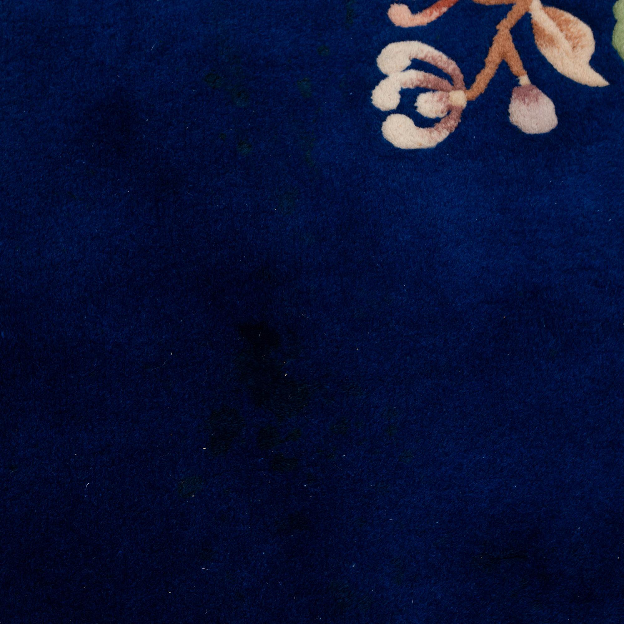 A CARPET, China, ca 304,5 x 242,5 cm (as well as 3 cm flat weave at the ends).