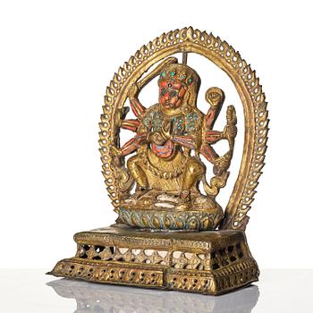 Gudom, förgylld kopparplåt med inläggningar. Nepal, omkring 1900.