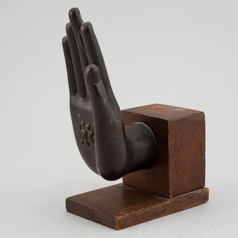 A bronze scultpure of a hand gesture, Thailand, 20th Century.