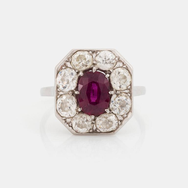 An 18K white gold ring set with a ruby and old-cut diamonds.