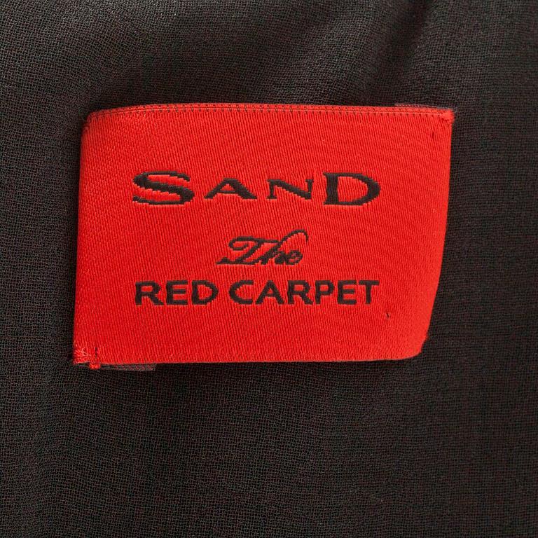 SAND red carpet, a sequin embellished dress.
