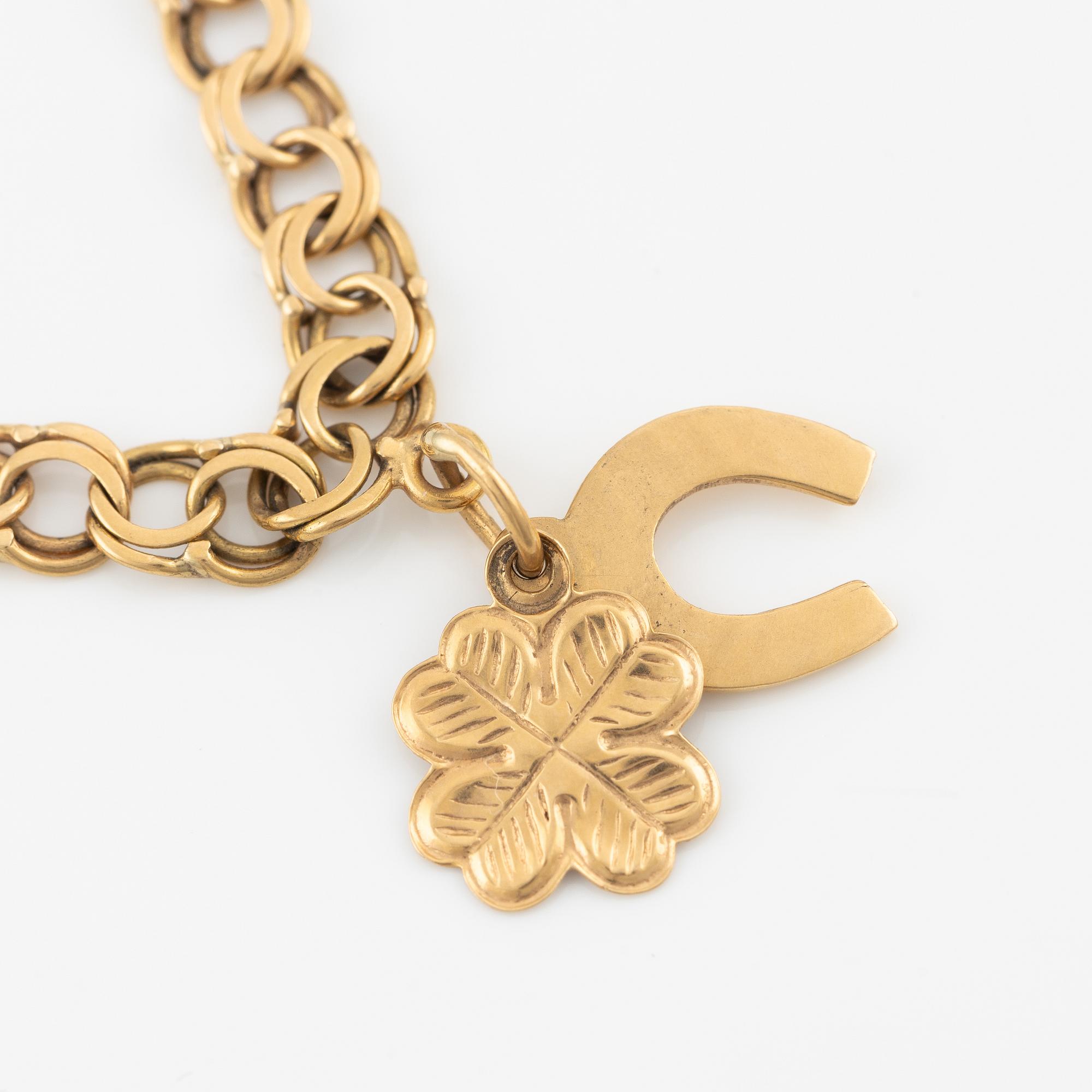 Armband, 18K guld, med berlocker.