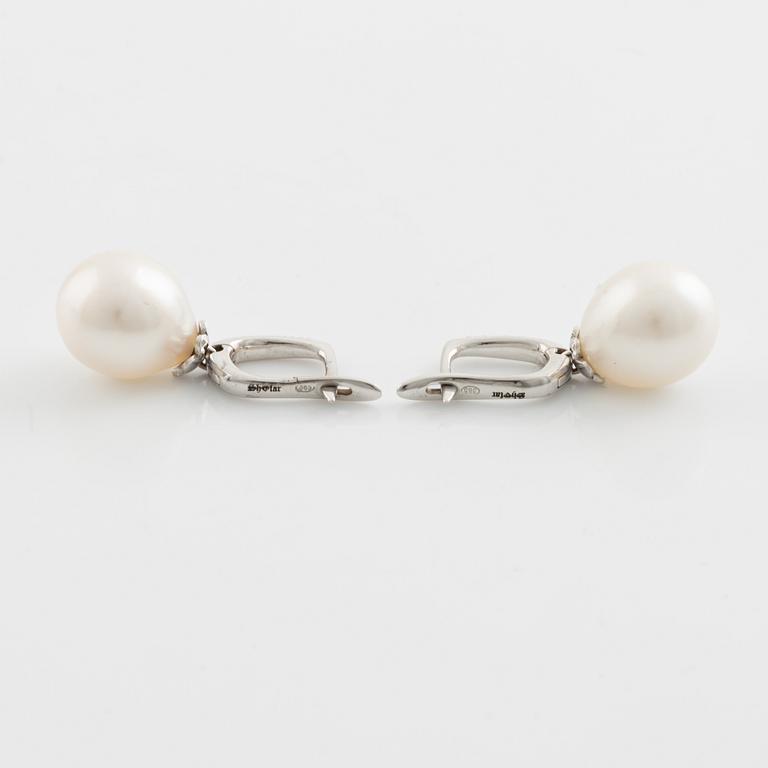 Freshwater pearl and brilliant cut diamond earrings.