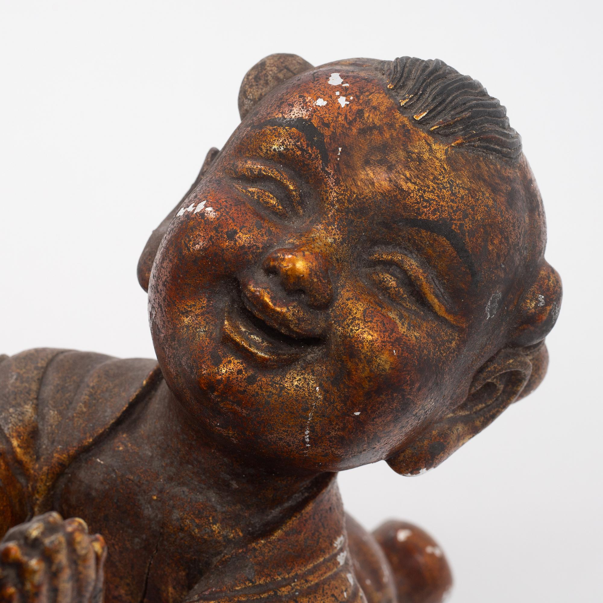 A large gilt and lacquer sculpture group, three parts, 20th century.