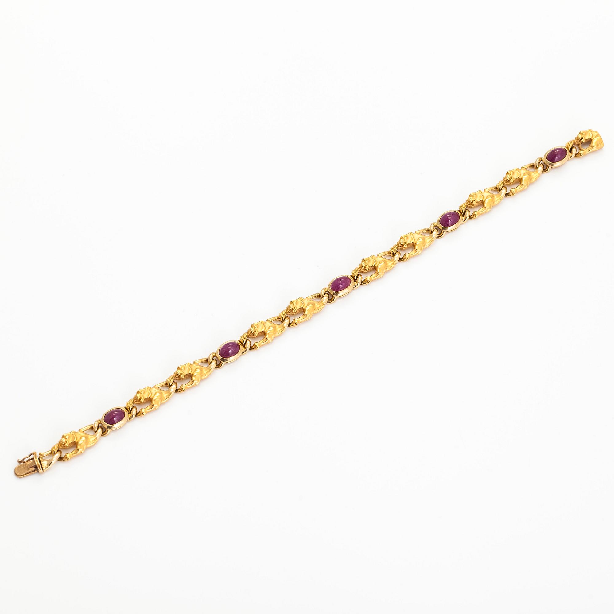 Carrera y Carrera, an 18K gold bracelet, in the shape of panthers with cabochon-cut rubies.