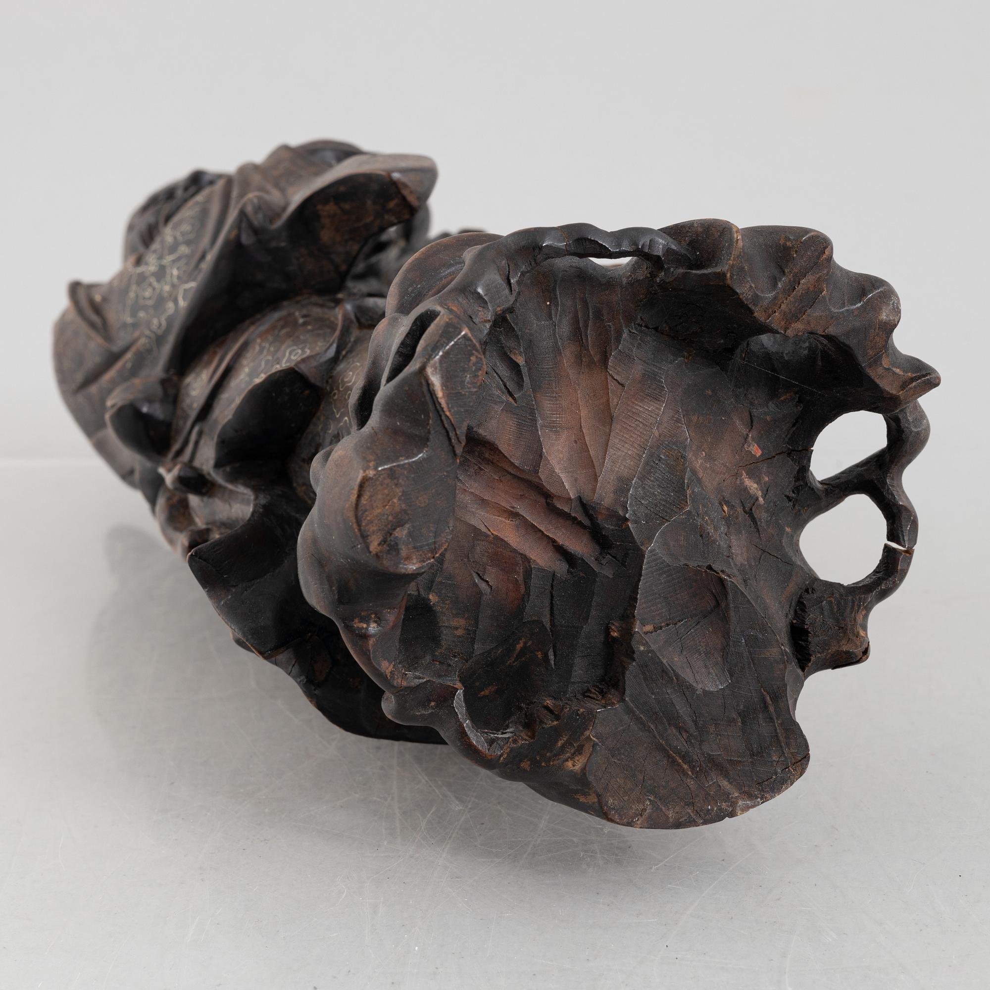 A Chinese wooden figure of 'Shoulao' with silver inlays, 20th century.