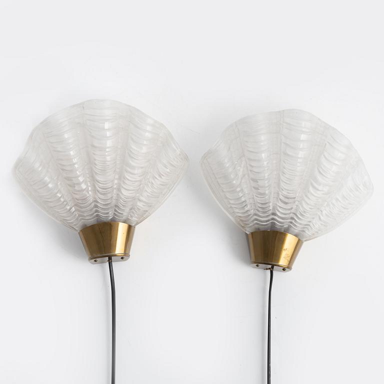A pair of glass and brass 'Coquille' wall lights from Asea, 1940's.