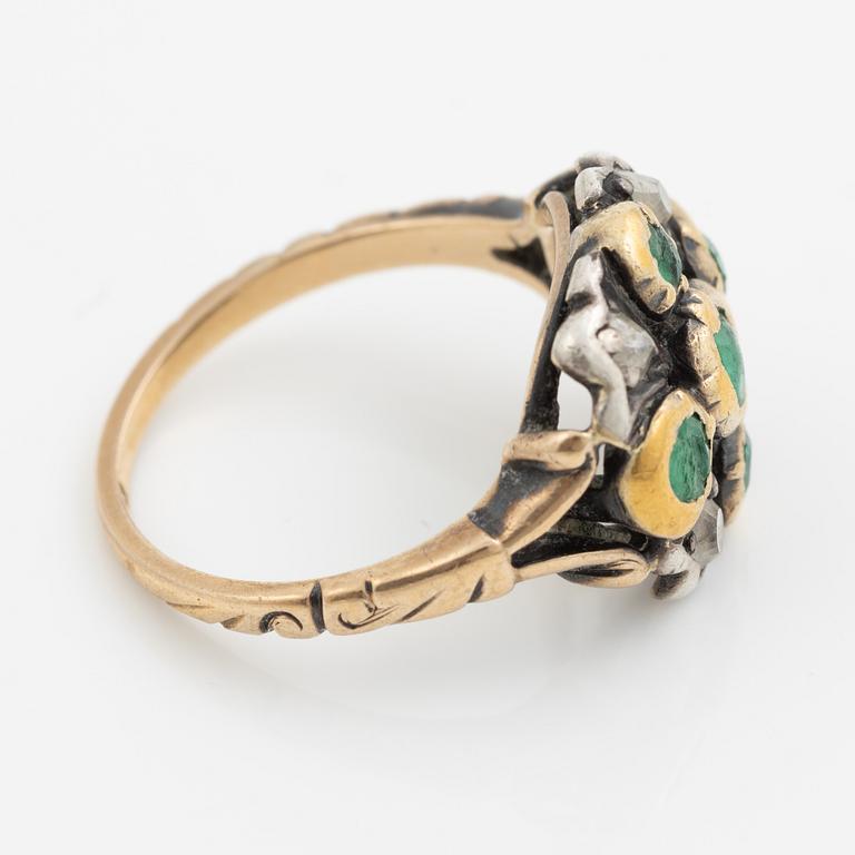 Ring 18K gold and silver set with old-cut diamonds and green stones.