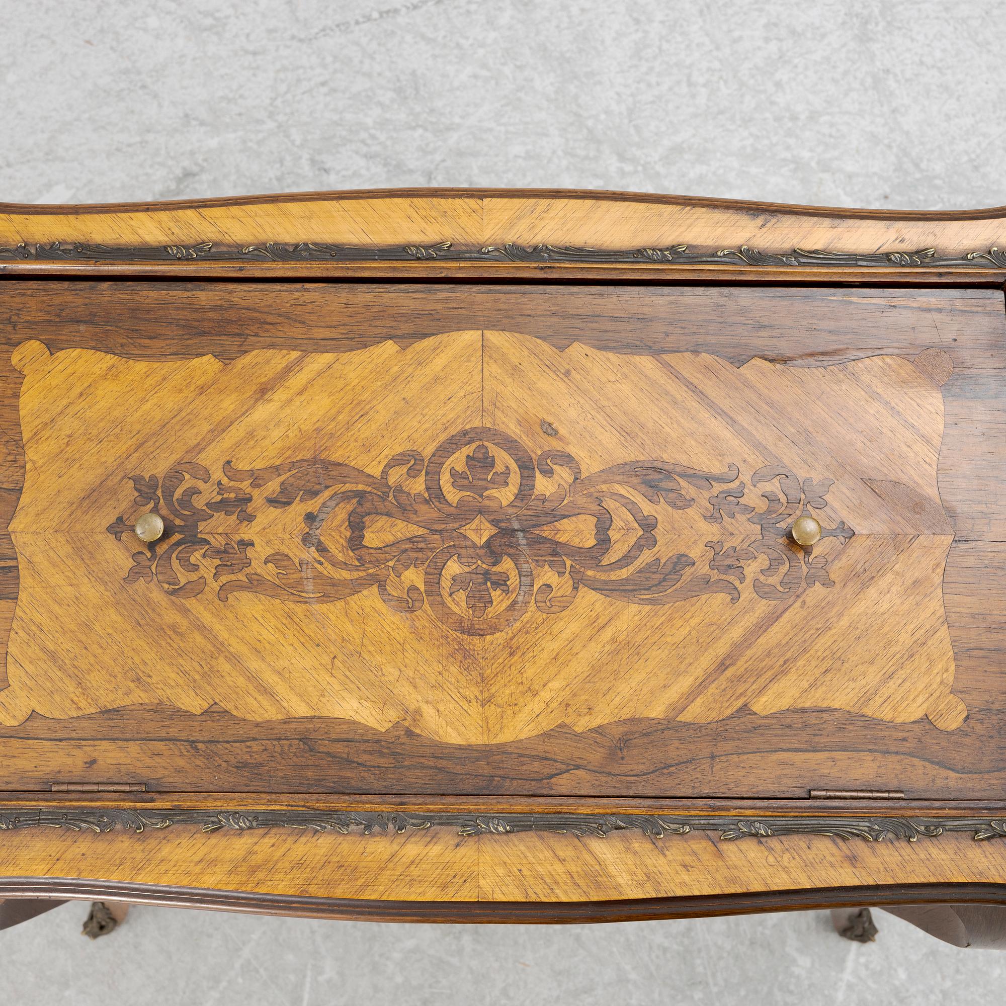 A Louis XV style table, circa 1900.