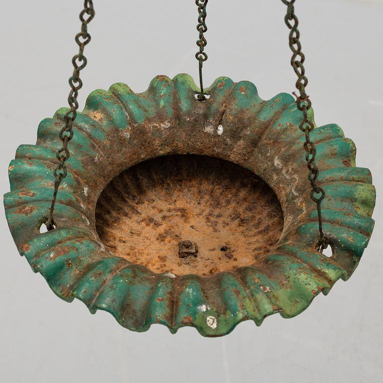 A CAST IRON  HANGING FLOWER POT, first half of the 20th century.