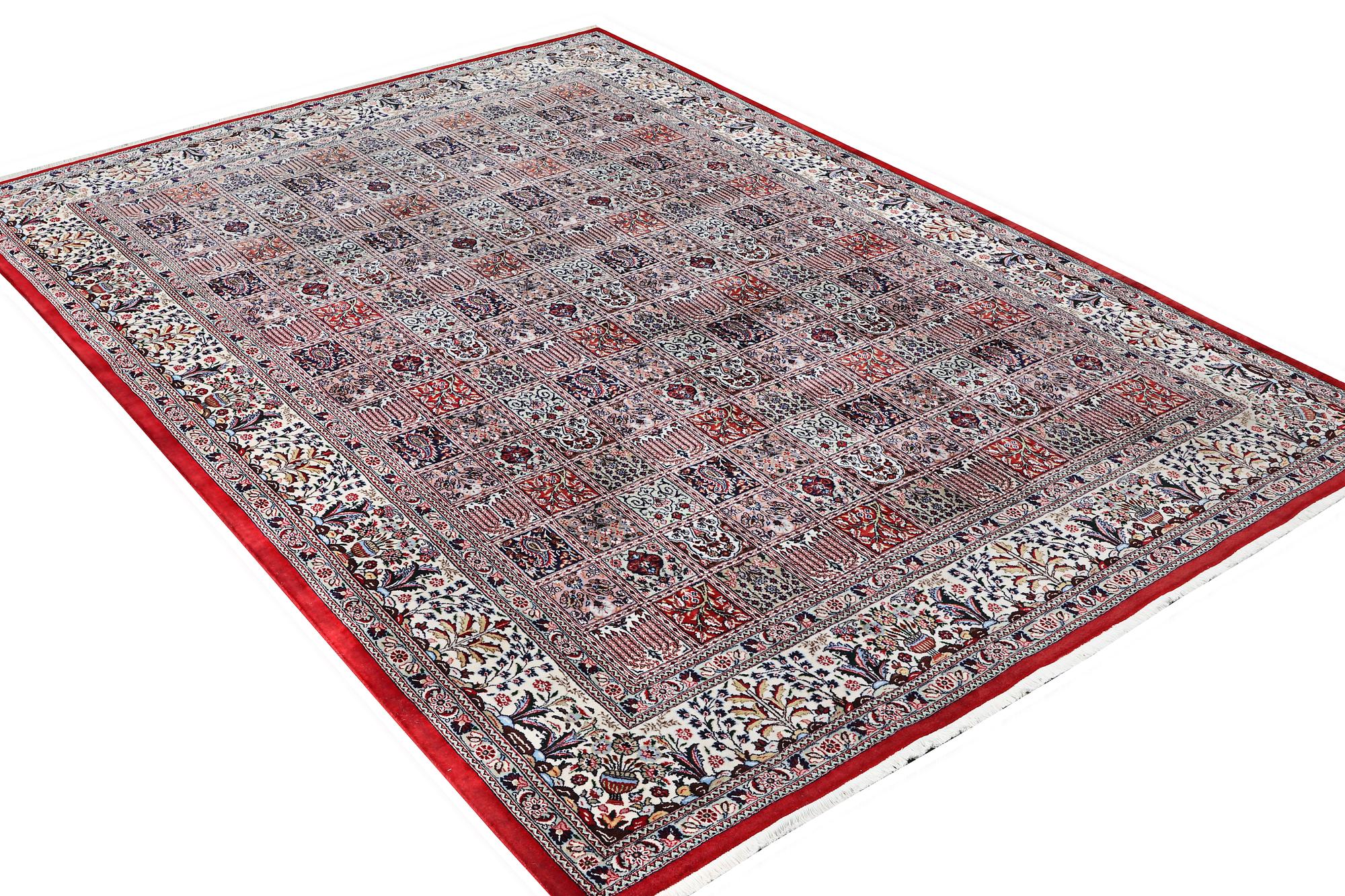 A part silk Ghom carpet, c. 346 x 251 cm.